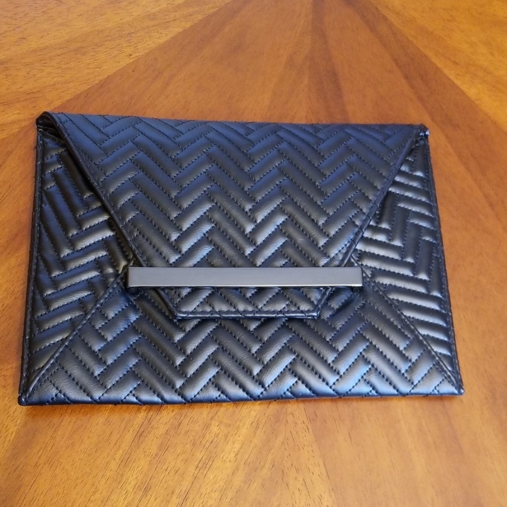 Black clutch or shoulder strap convertible purse